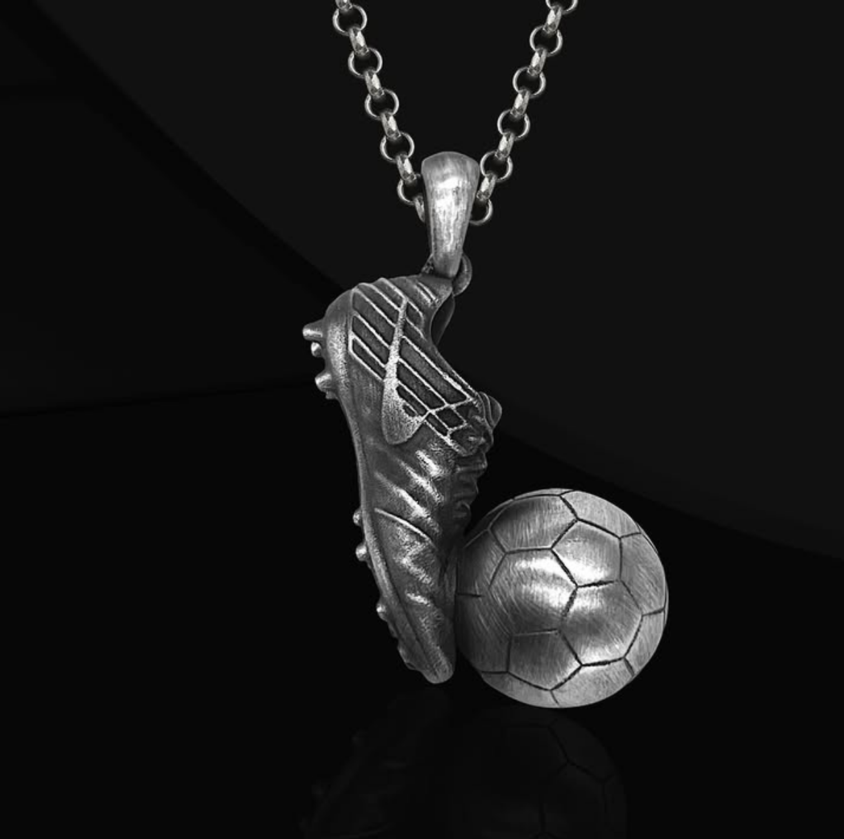 135-bap Serebryanyy kulon s futbol'nym myachom i butsami — simvol strasti, uporstva i lyubvi k igre Serebryanyy kulon s futbol'nym myachom i butsami — simvol strasti, uporstva i lyubvi k igre
